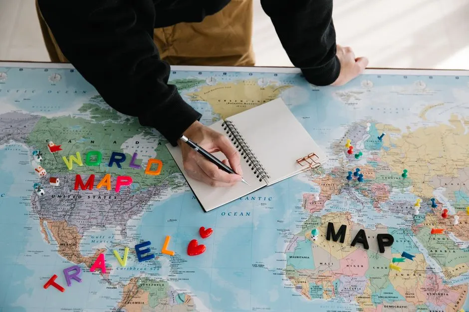 A traveler planning a trip with a notebook and map, illustrative of budget travel planning